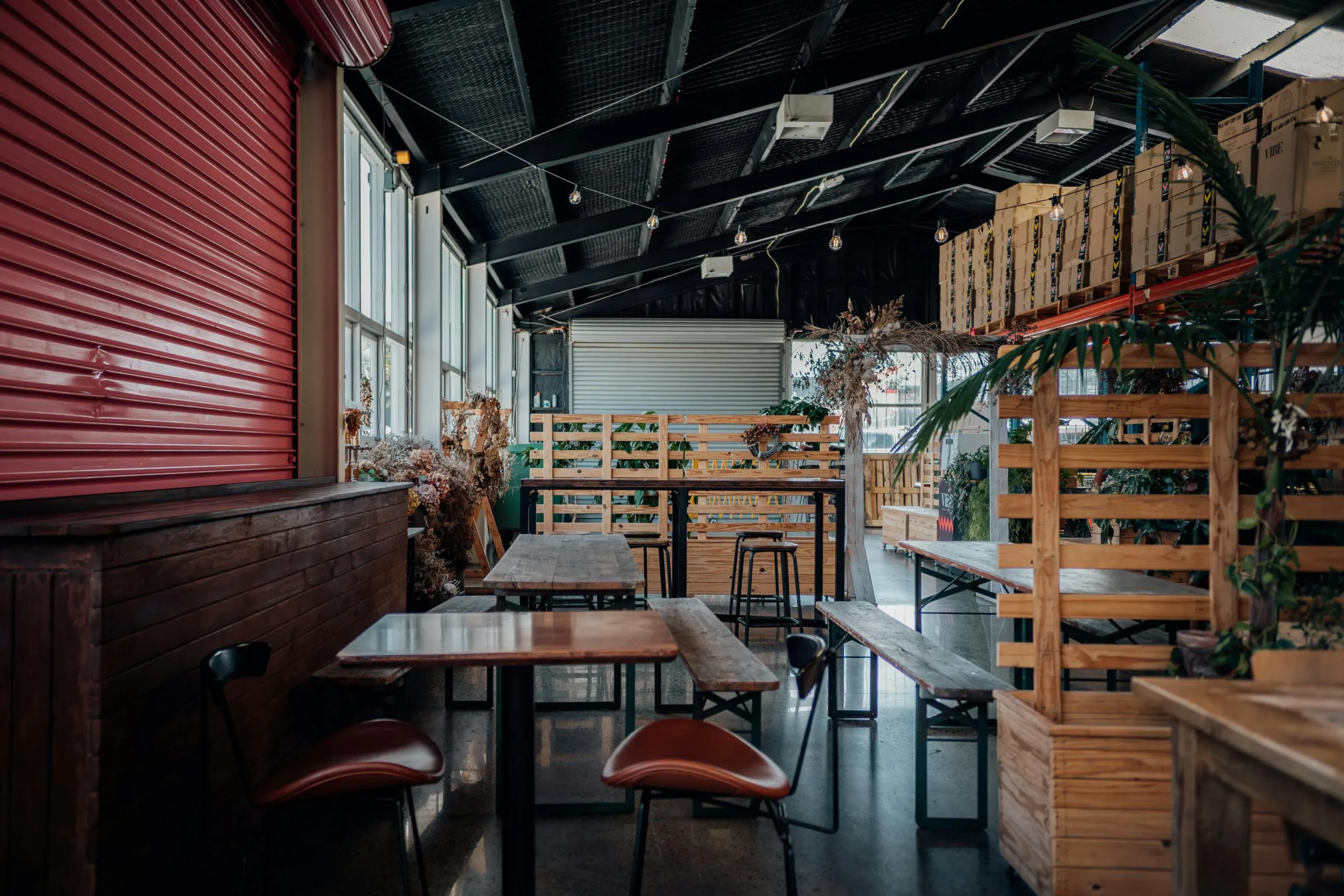 Business owner in Washington, DC standing near an ATM inside a convenience store