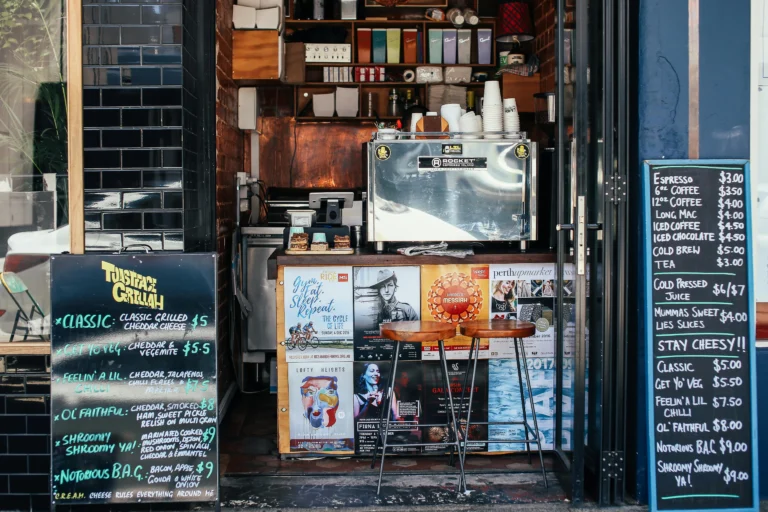 Business owner in Washington, DC standing near an ATM inside a convenience store